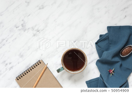 Cup of coffee and notebook Cup of coffee and notebook 50954909