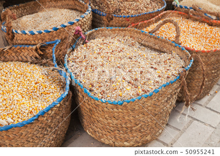 Dry corn and grains lie in baskets 50955241