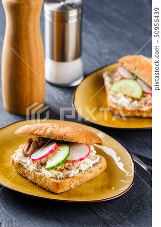 Delicious tuna sandwich, served with radish and 50956439