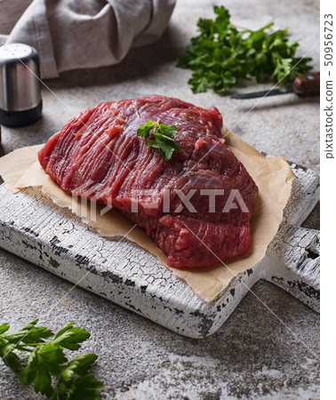 Raw meat on cutting board 50956723