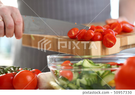 Chef Hands Pouring Cherry Tomato Cucumber Salad Chef Hands Pouring Cherry Tomato Cucumber Salad 50957330