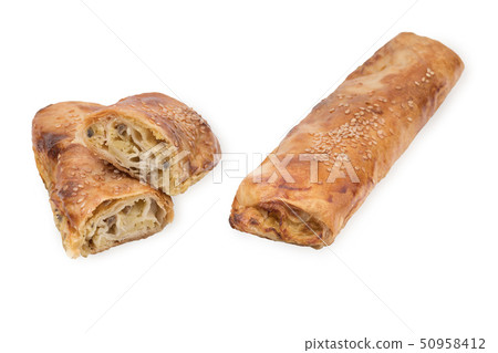 Baking puff pastry with potatoes and mushrooms, one pastry in the cut. Isolated on white background Baking puff pastry with potatoes and mushrooms, one pastry in the cut. Isolated on white background 50958412