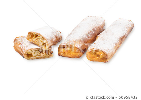 Baking puff pastry, one pastry in the cut. Sweet pastry with pumpkin, powdered sugar jam on a white Baking puff pastry, one pastry in the cut. Sweet pastry with pumpkin, powdered sugar jam on a white 50958432