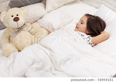 cute little child girl wakes up from sleep 50959181