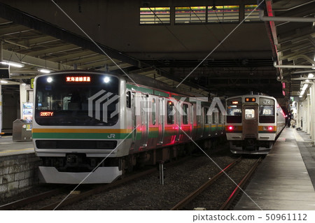 Series E231 and 211 stopping at Takasaki Station at night 50961112