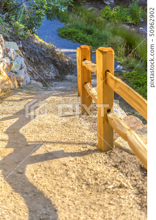 Wooden fence on downhill area in sunset Wooden fence on downhill area in sunset 50962902