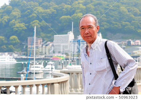 Senior man traveling Senior man traveling 50963023