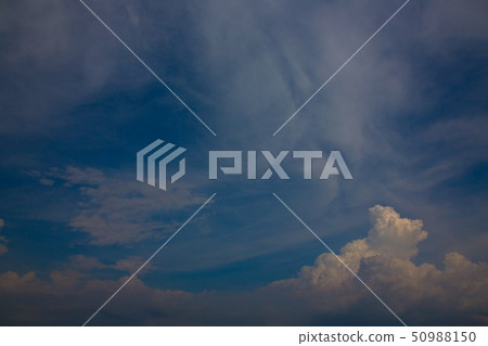 Clouds soaring in the sky, clear blue sky 50988150
