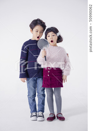 Cheerful boy and a girl on the white background 169 50990062