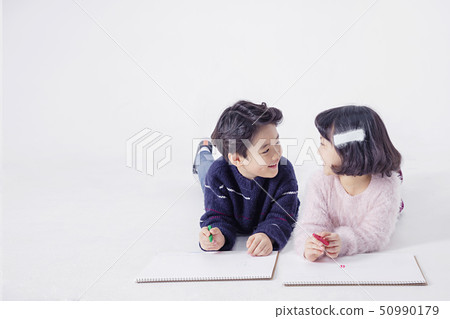 Cheerful boy and a girl on the white background 126 50990179