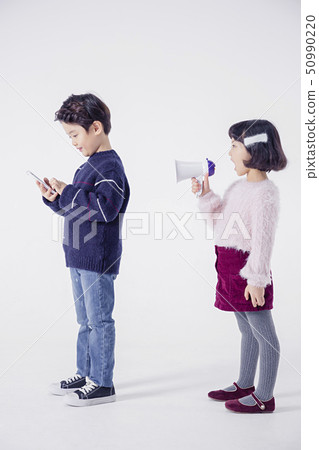 Cheerful boy and a girl on the white background 117 50990220