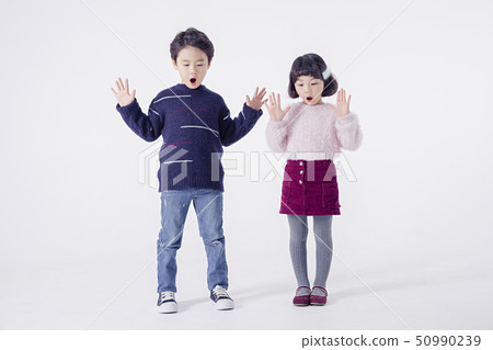 Cheerful boy and a girl on the white background 115 50990239