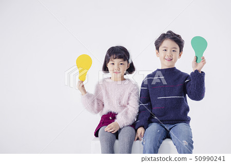 Cheerful boy and a girl on the white background 195 50990241