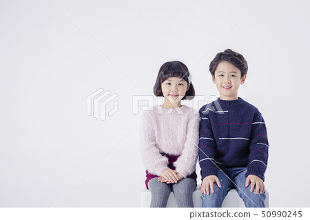 Cheerful boy and a girl on the white background 186 50990245