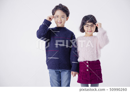 Cheerful boy and a girl on the white background 157 Cheerful boy and a girl on the white background 157 50990260