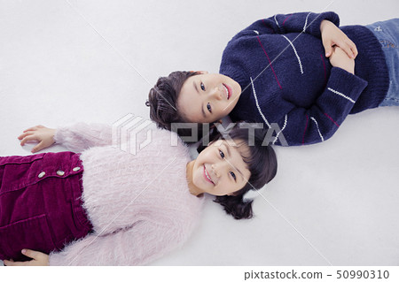 Cheerful boy and a girl on the white background 142 Cheerful boy and a girl on the white background 142 50990310