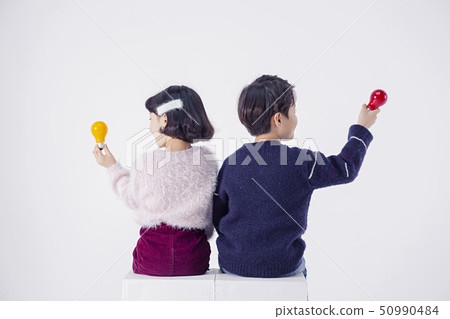 Cheerful boy and a girl on the white background 202 Cheerful boy and a girl on the white background 202 50990484