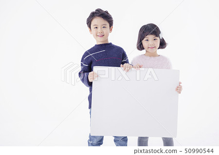 Cheerful boy and a girl on the white background 147 50990544