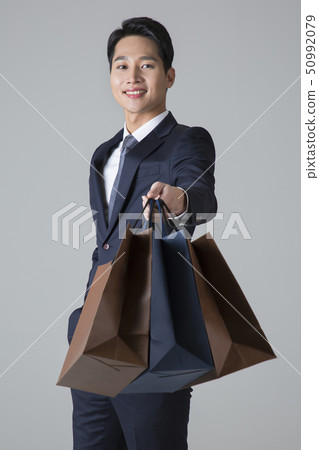 Attractive young man. sale, shopping, fashion, and style concept photo 324 50992079