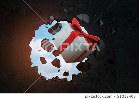 3d rendering of white gift box with red ribbon breaking black wall 3d rendering of white gift box with red ribbon breaking black wall 51012408