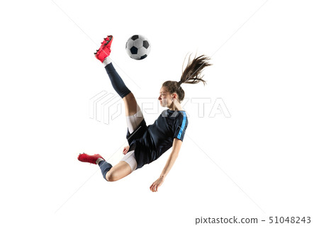 Female soccer player kicking ball isolated over white background Female soccer player kicking ball isolated over white background 51048243
