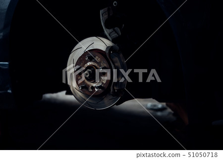 Disc brake and asbestos brake pads at car garage Disc brake and asbestos brake pads at car garage 51050718