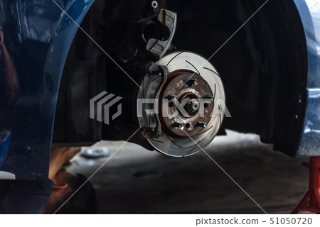 Disc brake and asbestos brake pads at car garage Disc brake and asbestos brake pads at car garage 51050720