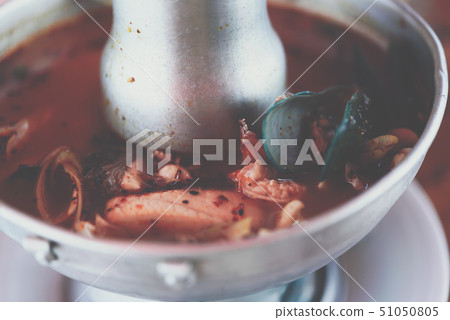 Prawn seafood spicy soup (Tom Yum Goong) at market 51050805