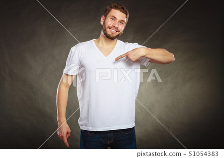 Man guy in blank shirt with copy space pointing. 51054383