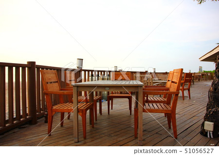 wooden table and desk on beach at sea view 51056527