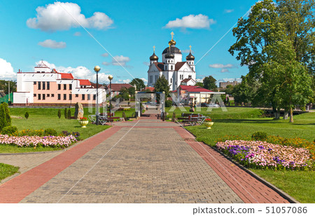 alley in the park lined with tiles with flowers on alley in the park lined with tiles with flowers on 51057086