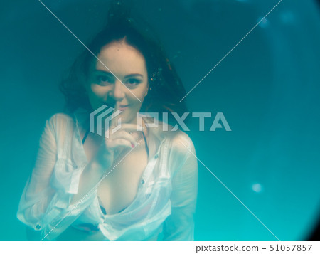 Underwater girl wearing bikini in swimming pool 51057857