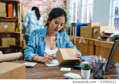 two women friends own online business two women friends own online business 51066221