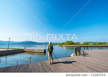 Togo pond Nordic walking blue sky 51093354