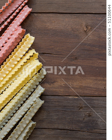 Tricolor mafalde pasta on the wood Tricolor mafalde pasta on the wood 51100644