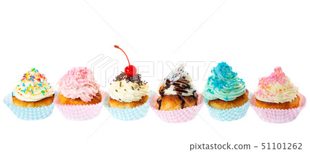 setting row of festive cupcakes with butter cream 51101262