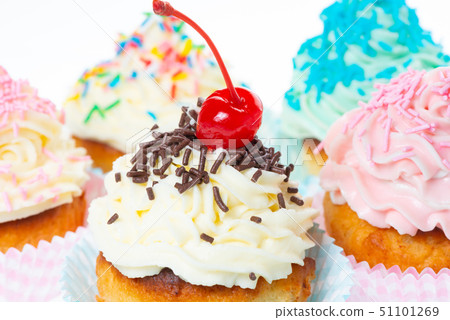 set of cupcakes with whipped cream decorated set of cupcakes with whipped cream decorated 51101269