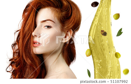 Hair treatment by oil therapy. Flying green olive splash. 51107992