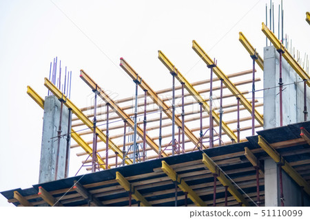 Wooden frames and metal reinforcement at new building construction site 51110099