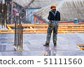 Back view construction site worker in helmet 51111560