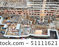 Top view snowy construction site with new appartment building 51111621