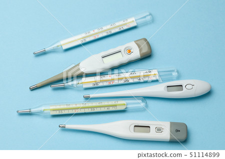 Medical thermometers glass and electronic on blue background 51114899