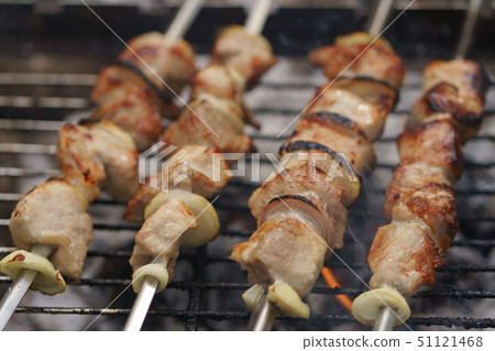 Cooking shish kebabs on the grill on the coals Cooking shish kebabs on the grill on the coals 51121468