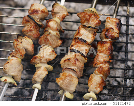 Cooking shish kebabs on the grill on the coals Cooking shish kebabs on the grill on the coals 51121472