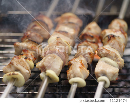 Cooking shish kebabs on the grill on the coals Cooking shish kebabs on the grill on the coals 51121474
