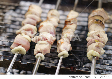 Cooking shish kebabs on the grill on the coals Cooking shish kebabs on the grill on the coals 51121482