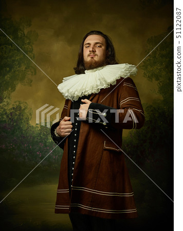 Young man as a medieval knight on dark background 51122087