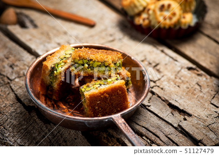 Arabic dessert with pistachio Kadayif pieces Arabic dessert with pistachio Kadayif pieces 51127479