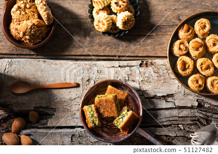 Arabic desserts in rustic bowls top view 51127482