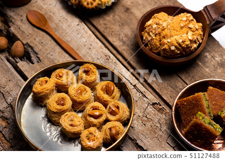 Arabic desserts in rustic bowls top view Arabic desserts in rustic bowls top view 51127488